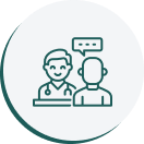 A green icon of two people with one person talking to another